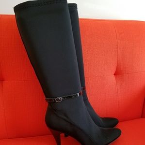 Black stretch fabric boots.